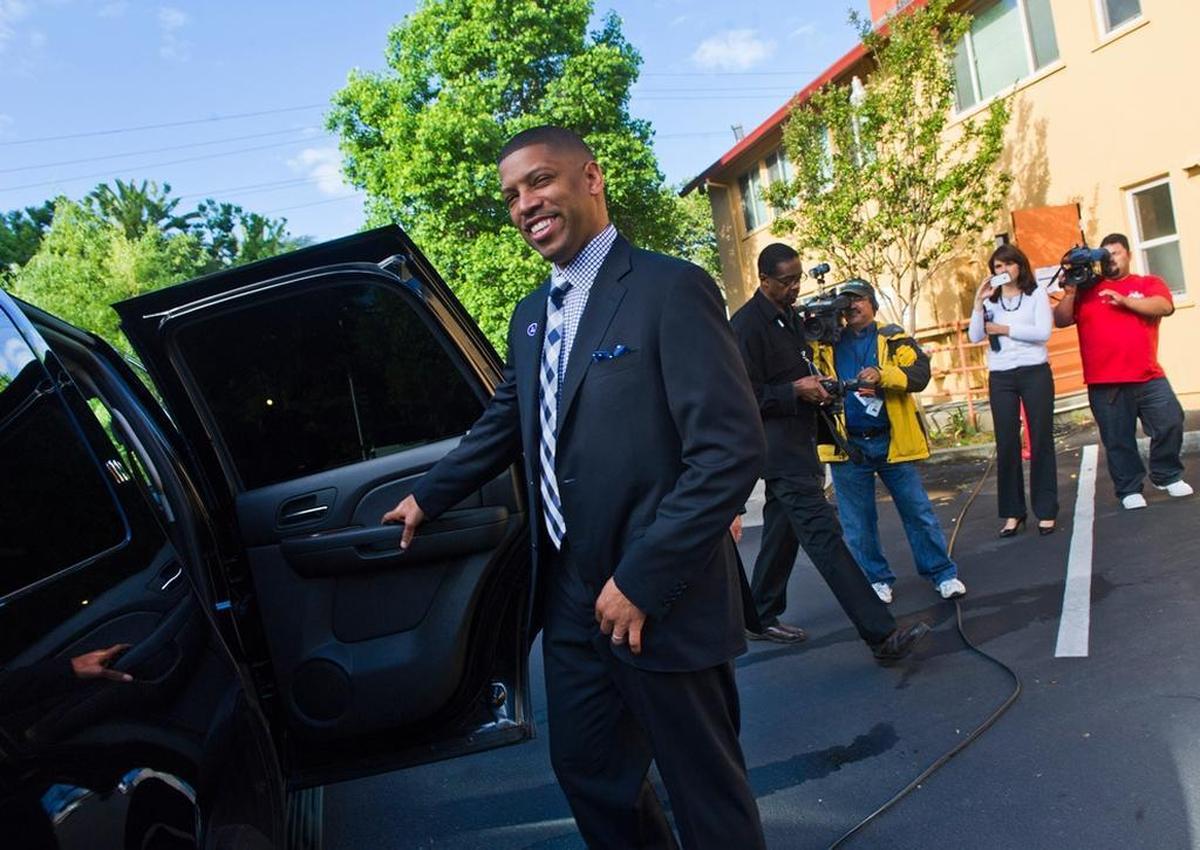 Former Sacramento Mayor Kevin Johnson enters his city SUV after voting with his wife Michelle Rhee at First Christian Church on election day in 2012.
