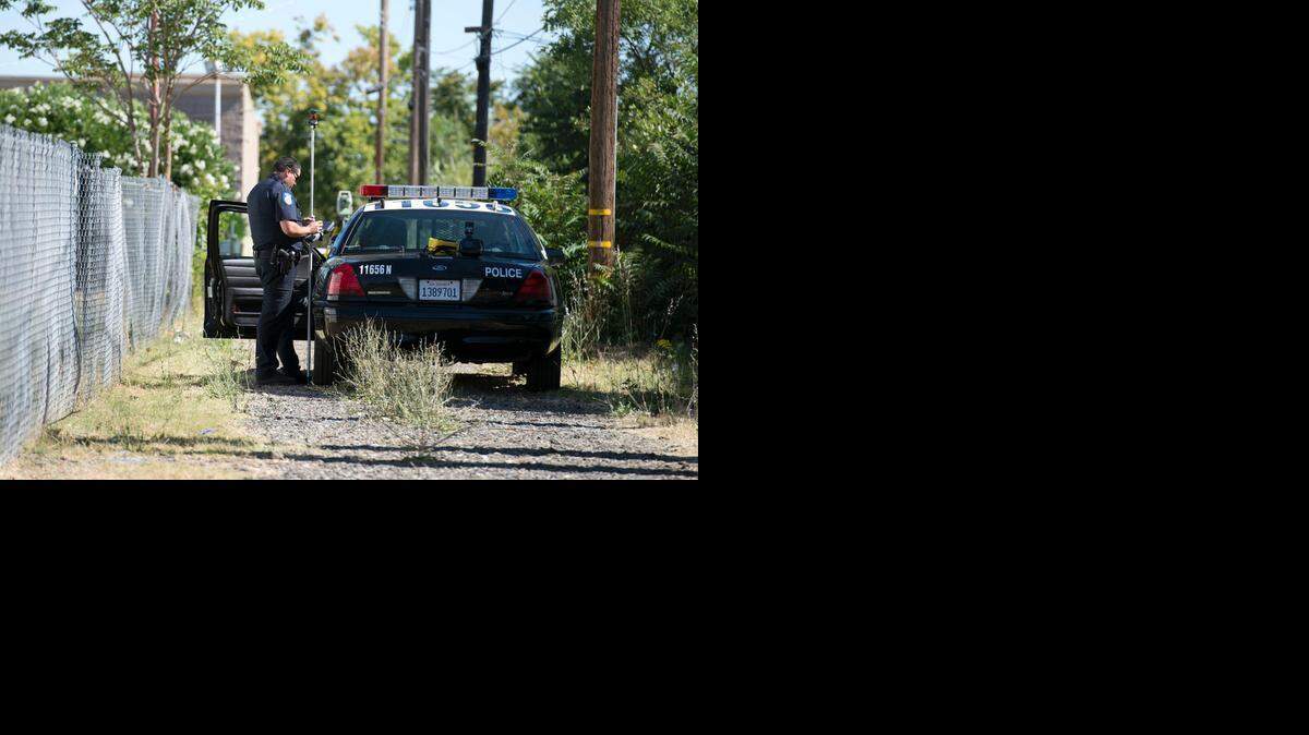 A Sacramento police officer works the scene of an incident in Del Paso Heights.