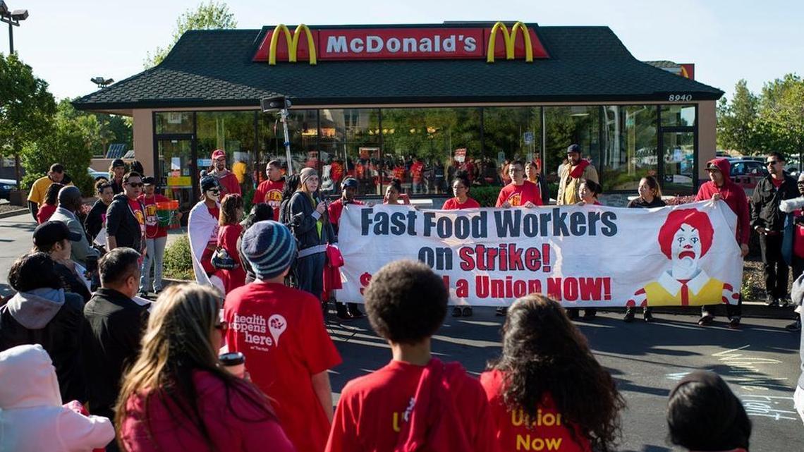
Participants of a rally The Fight for $15, a nationwide campaign for raising the minimum wage, used Tax Day, April 15, stand in front of a McDonald’s in Sacramento on Wednesday, April 15, 2015.
