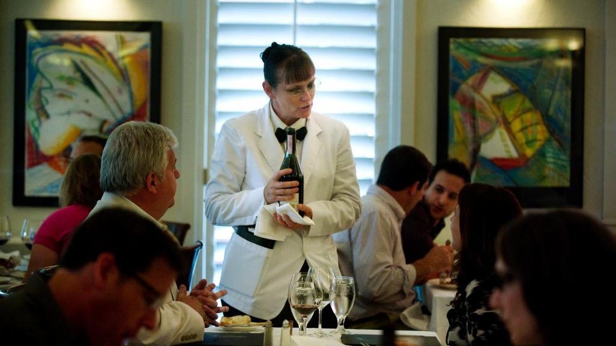 
A proposed Sacramento ordinance would exempt restaurants and other service businesses from paying a higher minimum wage to employees who receive at least $15 an hour in total compensation, including tips, but the state legislative counsel says such an exemption would be illegal.
