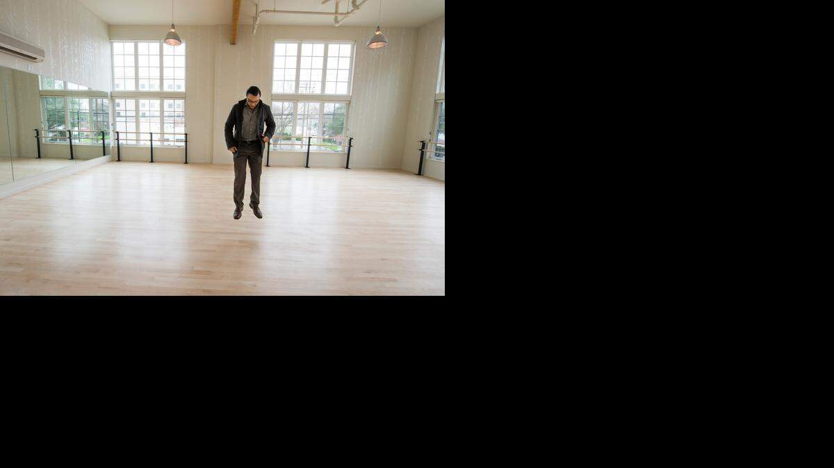 
Ali Youssefi of CFY Development jumps on a spring-loaded floor in the dance studio at the Warehouse Artist Lofts on R Street in Sacramento.
