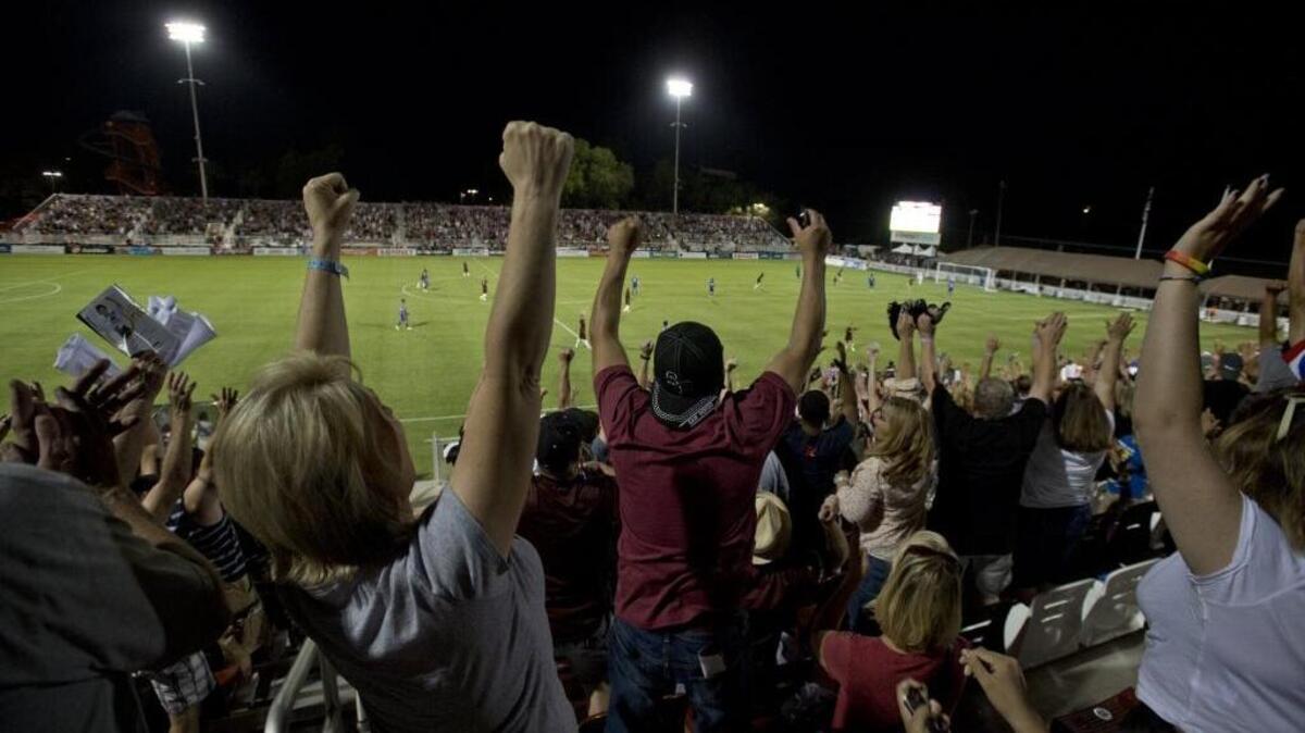 Fans celebrate after Republic FC goes up 4-3 late in the second half against the Colorado Rapids Reserves in the first soccer match at new Bonney Field at Cal Expo on June 20, 2014. Bonney Field will host an electronic dance music event in March and could host more concerts in the future.