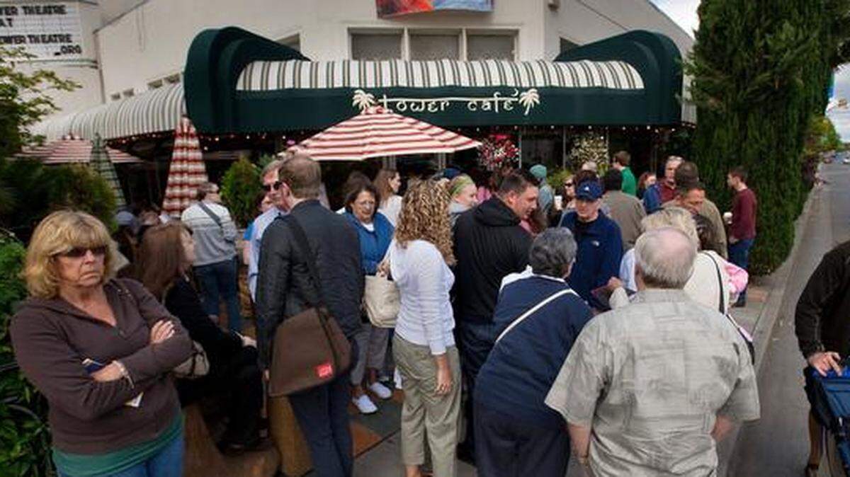 A crowd of people wait in a long line for tables at the Tower Cafe in Sacramento on Sunday, May 9, 2010.