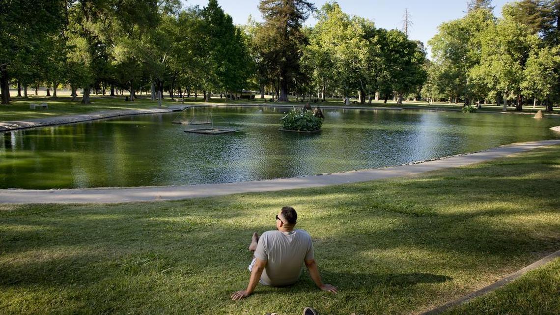 David Garcia listens to music as he enjoys the afternoon near the pond in William Land Park across from the Sacramento Zoo on June 2, 2014. The City Council is poised to approve a deal that would bring free Wi-Fi to Land Park and 26 other parks in Sacramento.