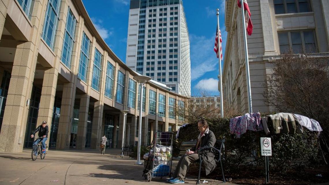 A homeless man, who asked not to be named, sits in the courtyard of Sacramento’s City Hall as someone else’s clothing dries on the bushes behind him on Friday. The monthlong protest by homeless activists has generated new attention to one of the city’s most pressing – and seemingly intractable – social issues. And after years of political resistance, that energy is leading some at City Hall to consider a city-approved “safe ground” designed to provide a transitional springboard for the homeless into permanent housing.