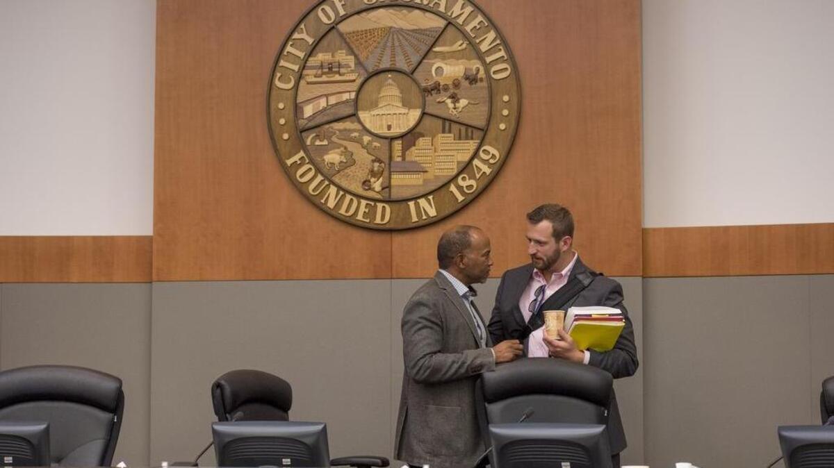
Sacramento City Councilman Allen Warren and Steve Hansen talk after the council meeting on May 12. Warren and Hansen had a testy exchange after Hansen opposed adding staff to the mayor’s office in the upcoming budget without the mayor present and able to defend it. Hansen will ask Tuesday for the city auditor to review Sacramento’s sexual harassment policies after allegations made against Warren and Mayor Kevin Johnson this year.
