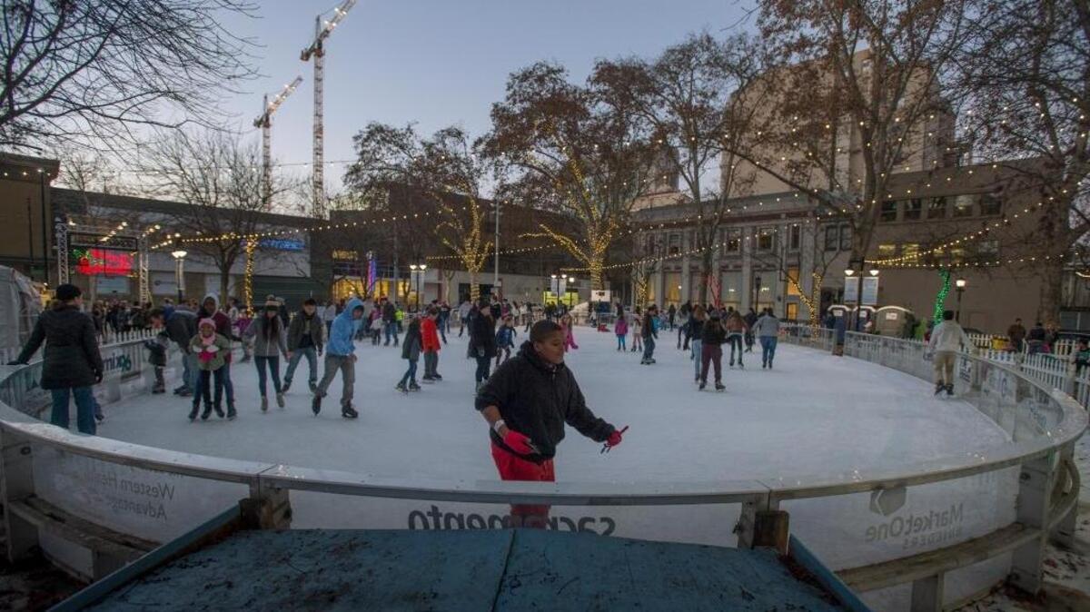 Skaters enjoy the holidays on ice at the Downtown Sacramento Holiday Ice Rink in St. Rose of Lima Park on Wednesday, Dec. 30, 2015.