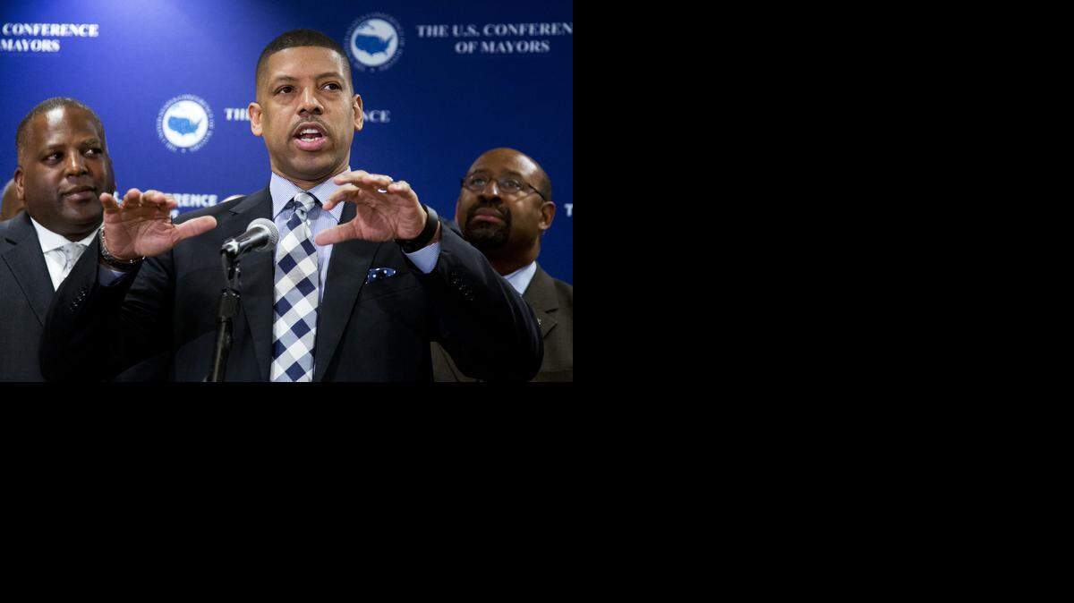 
Kevin Johnson, U.S. Conference of Mayors president, center, is flanked by Columbia, S.C., Mayor Stephen Benjamin, left, and Philadelphia’s Michael Nutter at the organization’s 83rd winter meeting Wednesday in Washington, D.C.
