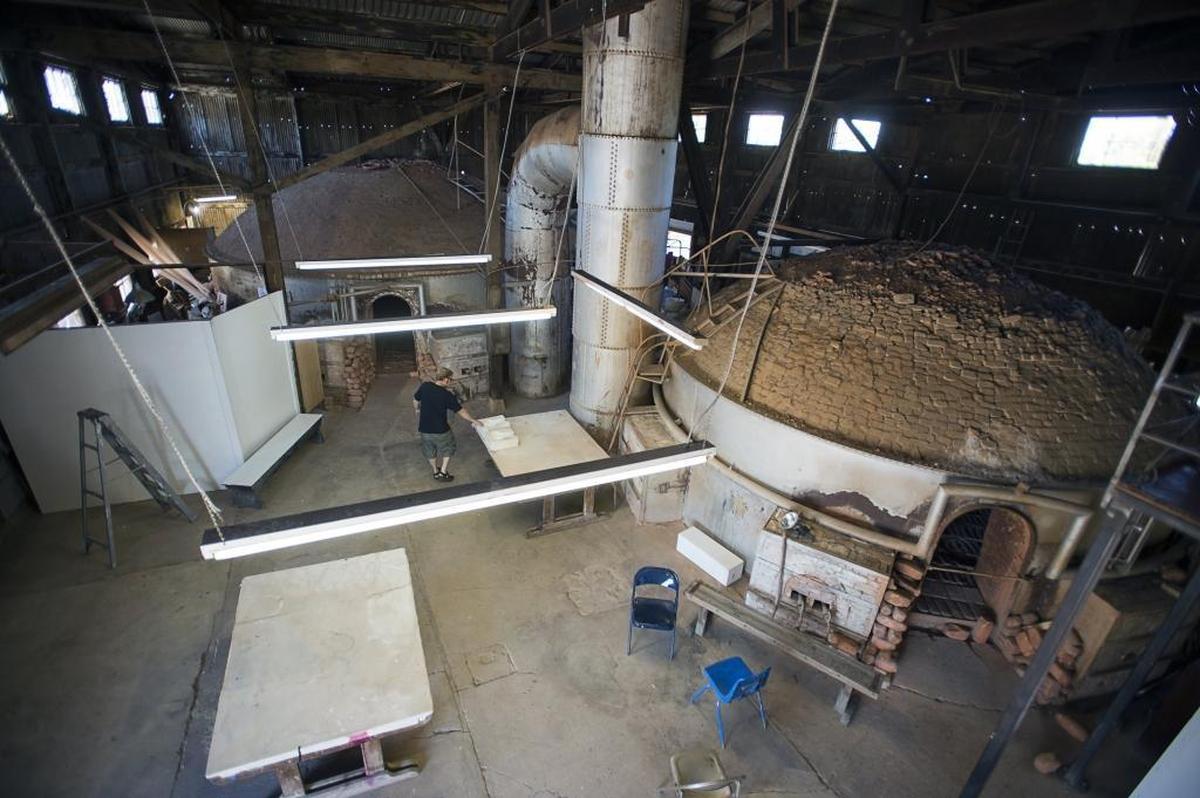 Artist Dave Davis walks near one of the old unused pottery kiln in the Panama Pottery Factory, an artists collective in Hollywood Park on Monday in Sacramento. The city of Sacramento is trying to shut down the occupancy of the building.