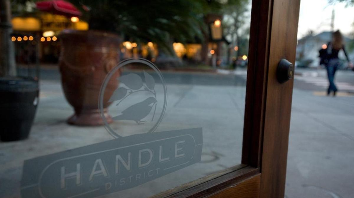
A sign etched in the front door of the Zocalo restaurant displays an advertisement for the Handle District. Some restaurants in the area – including Zocalo – include a 1.5 percent surcharge on customer bills to help fund the district.
