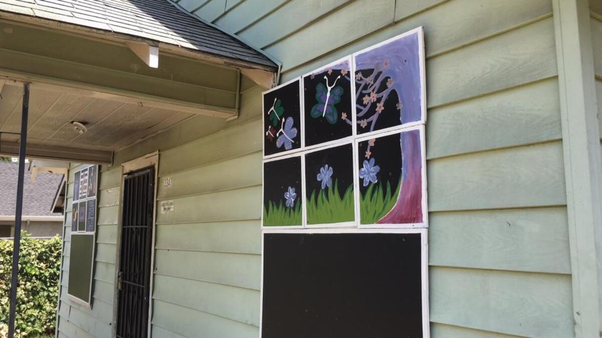 Colorful artwork covers the windows of a vacant home in Oak Park. City officials want young artists to paint boards to be placed on abandoned homes in Oak Park and Del Paso Heights.
