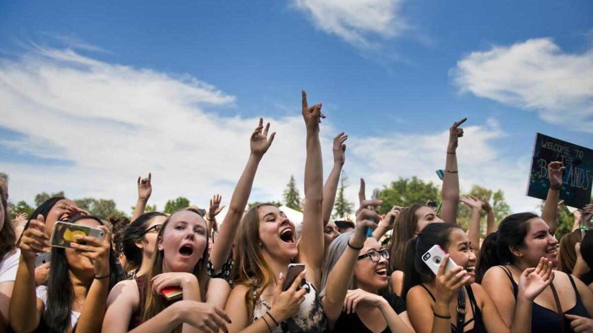 
Fans cheer for Halsey before she performs at the City of Trees music festival at Gibson Ranch on Aug. 15, 2015. Many fans complained about traffic, a water shortage and overflowing garbage cans at the event.
