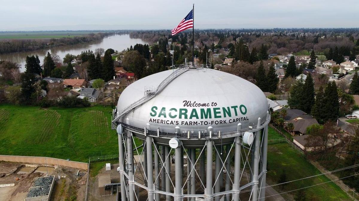 The new sign on the water tower off Interstate 5, pictured Friday, March 10, 2017, now reads “America’s Farm-to-Fork Capital” instead of “City of Trees.”