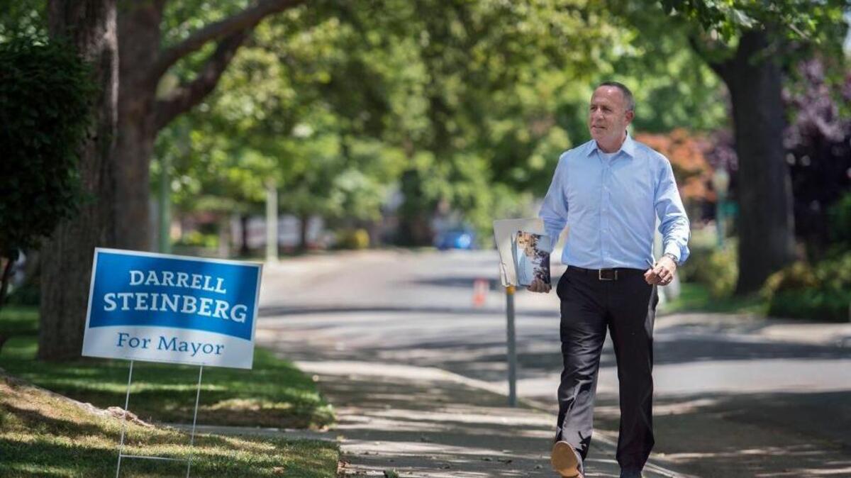 Darrell Steinberg walks door-to-door for a couple of hours in Land Park as he campaigns for mayor on Thursday, May 12, 2016, in Sacramento, Calif.