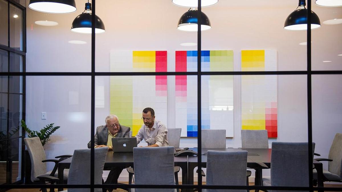 Ali Youssefi and his father, Cyrus Youssefi, of CFY Development Inc., reviewed development plans in their office in October, 2017.