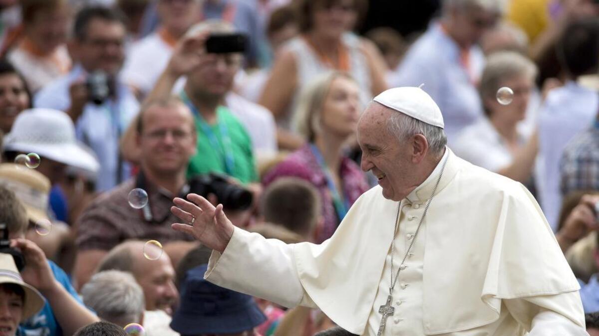 
Soap bubbles fly as Pope Francis arrives for his weekly general audience in St. Peter's Square at the Vatican, Wednesday, Sept. 2, 2015.
