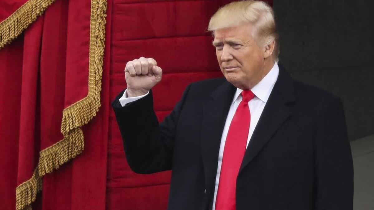 President-elect Donald Trump pumps his fist as he arrives during the 58th Presidential Inauguration at the U.S. Capitol in Washington, Friday, Jan. 20, 2017.