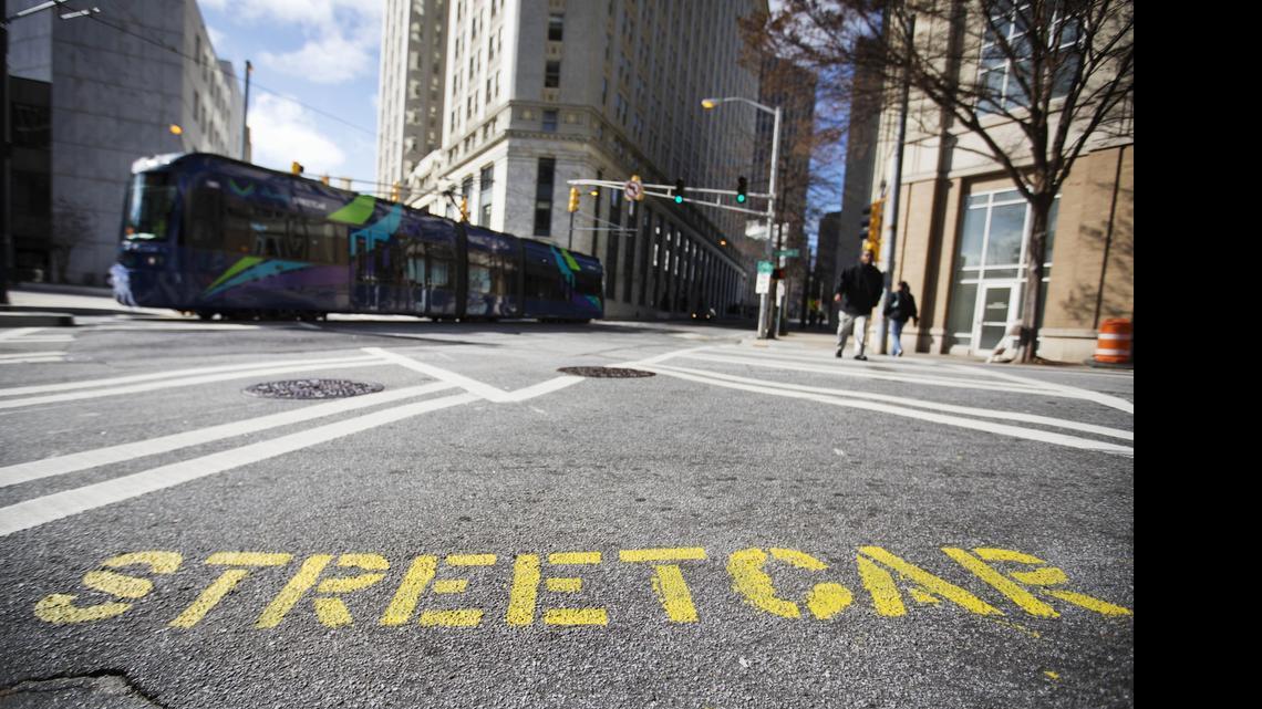 
In Atlanta, a painted message on the street alerts pedestrians to a streetcar ahead. In Sacramento, voters have defeated Measure B, which would have funded streetcars in the urban core.

