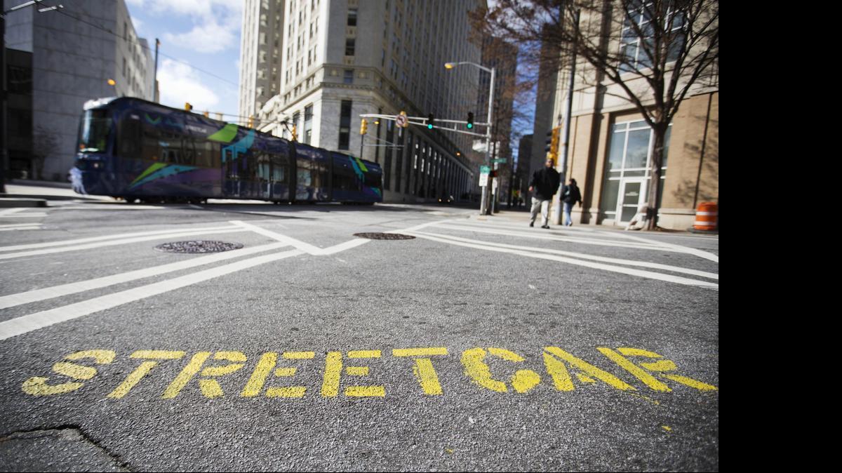 
In Atlanta, a painted message on the street alerts pedestrians to a streetcar ahead. In Sacramento, voters have defeated Measure B, which would have funded streetcars in the urban core.
