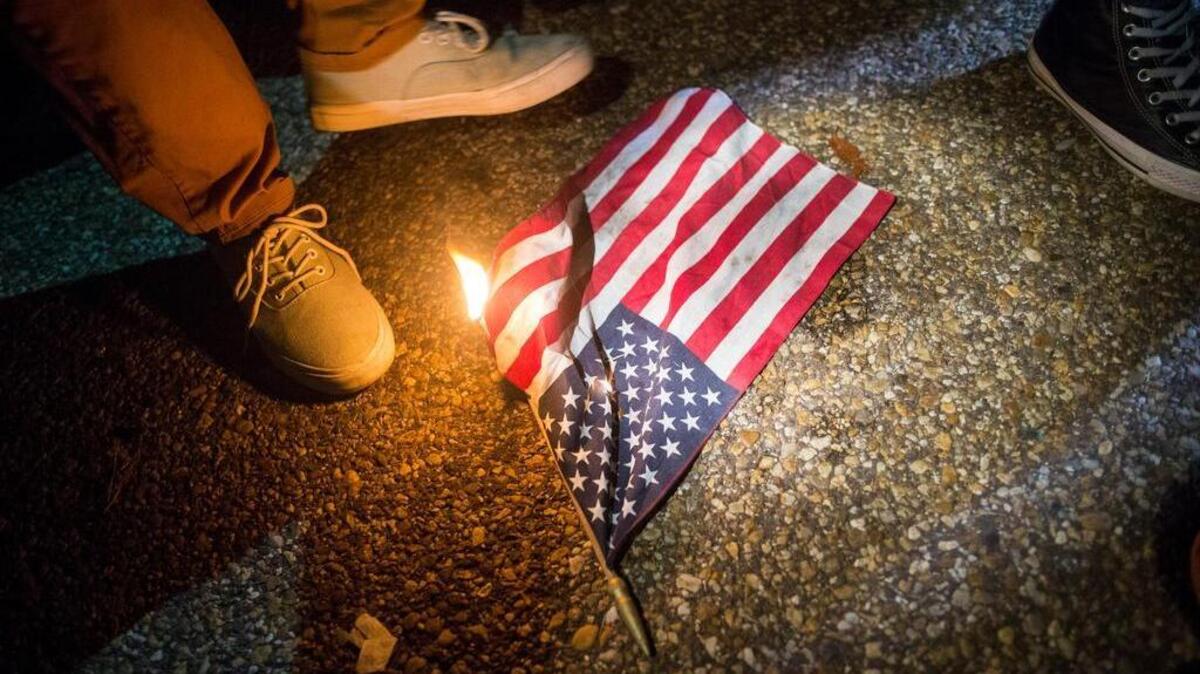 A small American flag is burned outside the White House in the early morning hours of Nov. 9, 2016, the day after Election Day. President-elect Donald Trump said in a Twitter post Nov. 29 that Americans who burned the flag should be jailed or lose their citizenship – though there is direct Supreme Court precedent that it is protected speech under the Constitution.