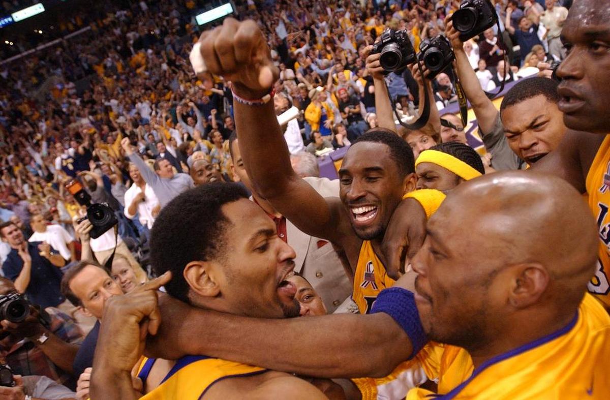 Robert Horry is surrounded by teammates Kobe Bryant and Mitch Richmond after making a three point basket at the buzzer to win game four of the  NBA Western Conference Finals between the Sacramento Kings and the Los Angeles Lakers at Staples Center, Sunday, May 26, 2002. 