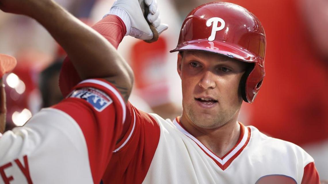 Philadelphia Phillies’ Rhys Hoskins is cheered in the dugout after hitting a two-run home run during the first inning of a baseball game against the Chicago Cubs, Aug. 25, 2017, in Philadelphia.