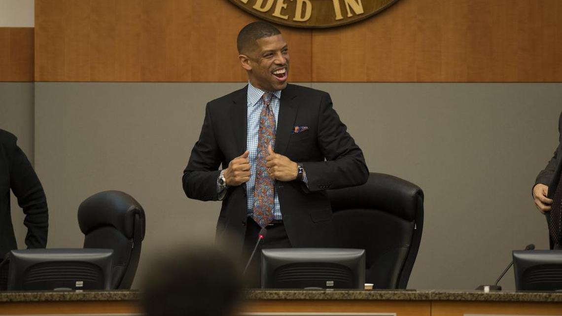 Sacramento mayor Kevin Johnson reacts after it is announced that his mother, Georgia West, will say the pledge of allegiance anthem on Dec. 6 before the council meeting.