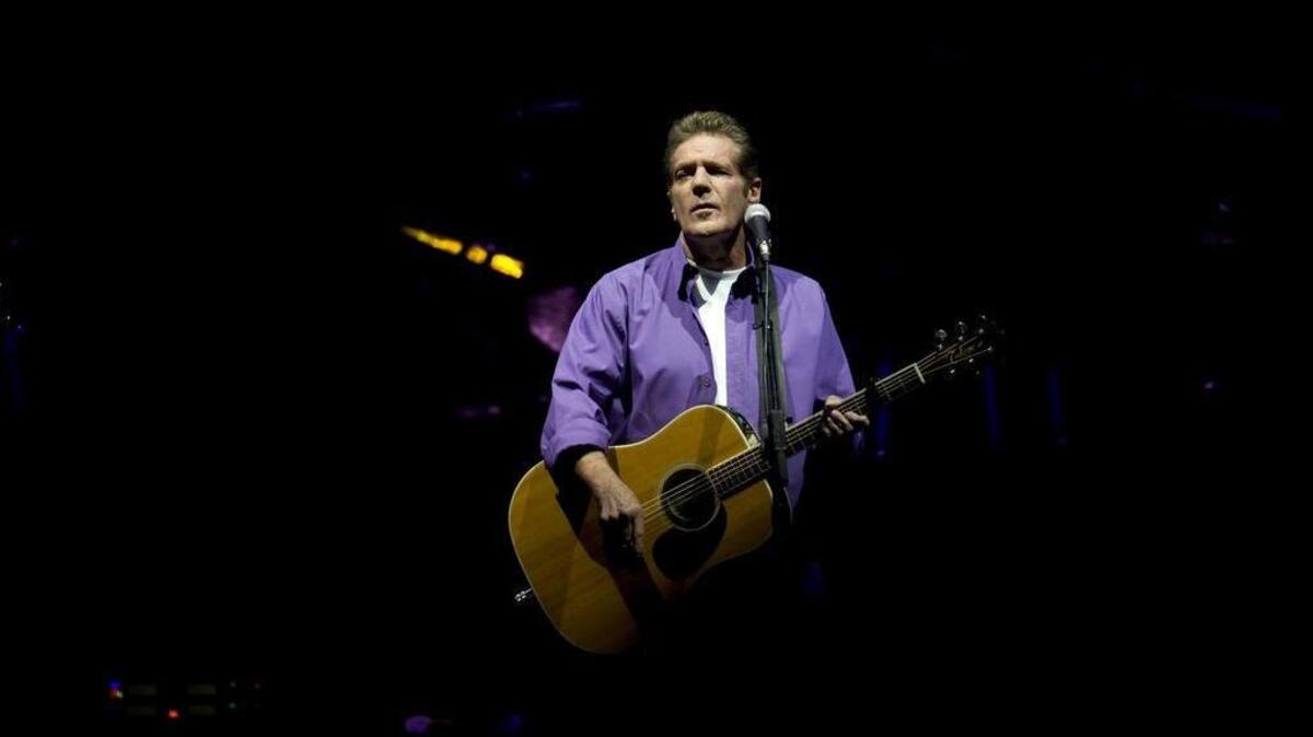 Glenn Frey delights fans with his acoustic guitar during the Sacramento stop of the Long Road Out of Eden tour on April 27, 2010, at Arco Arena.