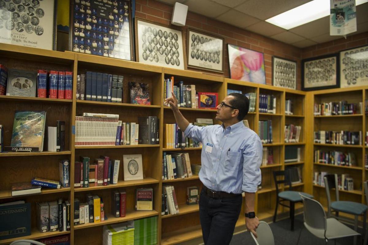 Jorge Aguilar points out his Parlier High School senior class of 1990 during a visit to his former high school near Fresno on May 16, 2017. Aguilar was one of four graduates who attended UC Berkeley and is now the new Sacramento City Unified superintendent.