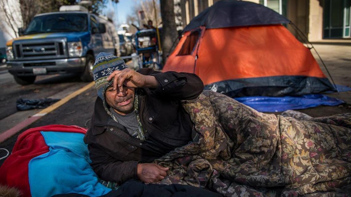 Ivan Dixon is one of the homeless protesters outside City Hall. They have accused police of “criminalizing” camping. City policymakers say it’s a public health issue.