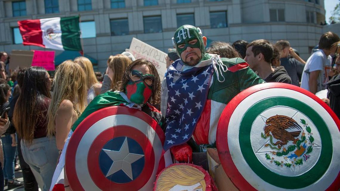 Anti-Trump protesters dressed as ‘Captain Mexico’ pose for a photo at outside of California Republican Party Convention last month in Burlingame.
