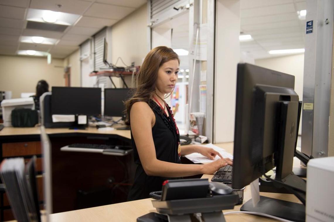 Doris Romero works the information window at the financial aid office at Sierra College in Rocklin on Aug. 30, 2017.