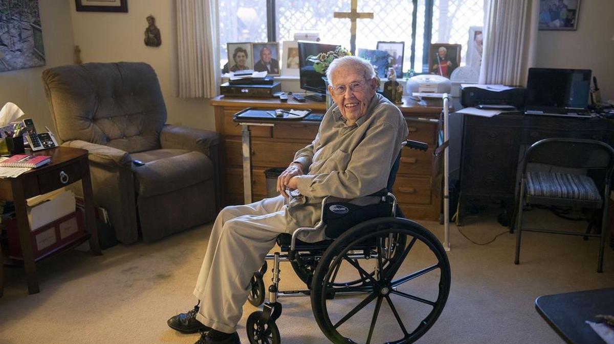 Francis Quinn, seen in his care site room, has written a book, “Behind Closed Doors: Conflicts in Today’s Church.”