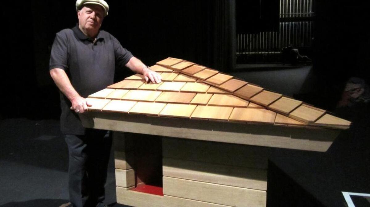 Jim Berger of Orangevale is shown with the doghouse he built according to a design by architect Frank Lloyd Wright. Berger grew up in a Wright-designed home in San Anselmo and, at age 12, he wrote to Wright requesting a design for a doghouse for the family’s Labrador retriever.