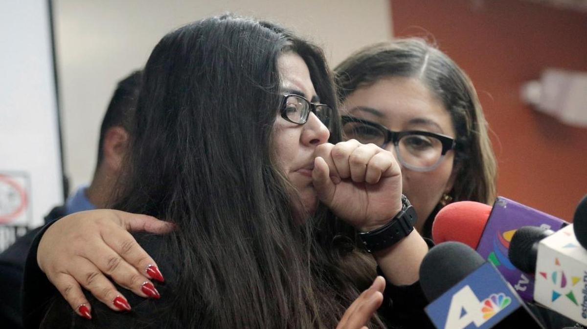 Marlene Mosqueda, left, whose father was deported early Friday, Feb. 10, 2017, is comforted at a news conference by her attorney Karla Navarrette at The Coalition for Humane Immigrant Rights of Los Angeles. Navarrete, said she sought to stop Mosqueda from being placed on a bus to Mexico and was told by ICE that things had changed. She said another lawyer filed federal court papers to halt his removal.