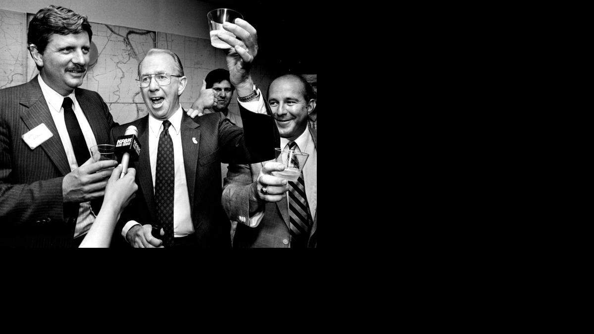 
Glen Craig makes a champagne toast at his campaign headquarters in 1986, shortly after claiming an upset win over Sheriff Robbie Waters. At left is supporter Lou Blanas, who later succeeded Craig as sheriff. Rival candidate Bob Lyon, right, also stopped by to offer his congratulations. 
