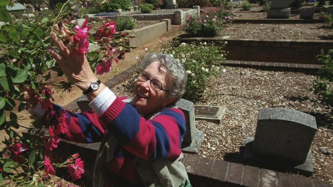 
Barbara Oliva was curator of the rose garden in the old Sacramento City Cemetery. She tends the garden in this 2001 photo.
