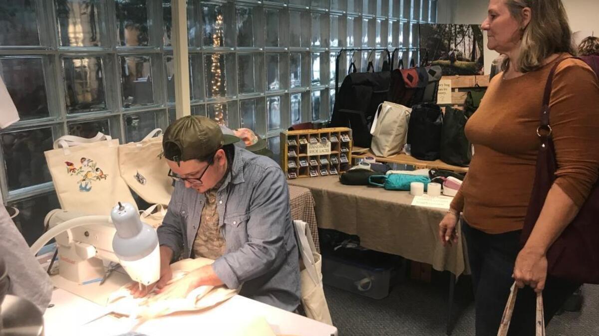 Samuel Parkinson works on a sewing machine during Saturday’s Makers Mart, a shopping event highlighting local artists and craft creators in the Sacramento area.