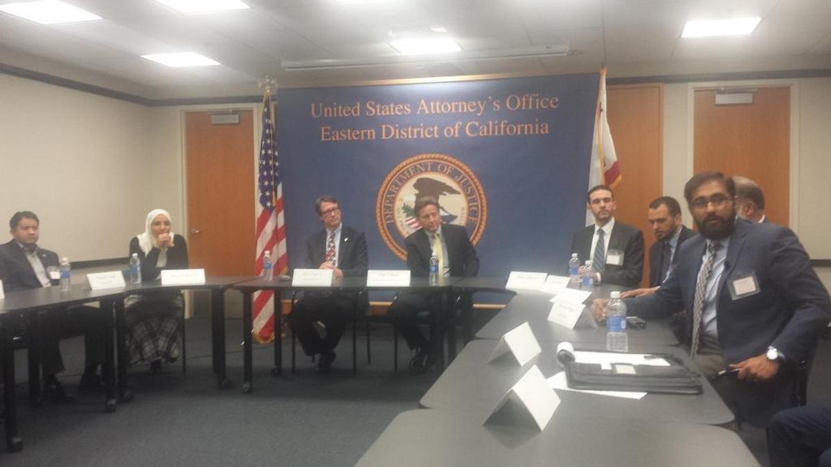 U.S. Attorney Ben Wagner, seated closest to the flag, meets with Sacramento area Muslim leaders Thursday, April 14, 2016.