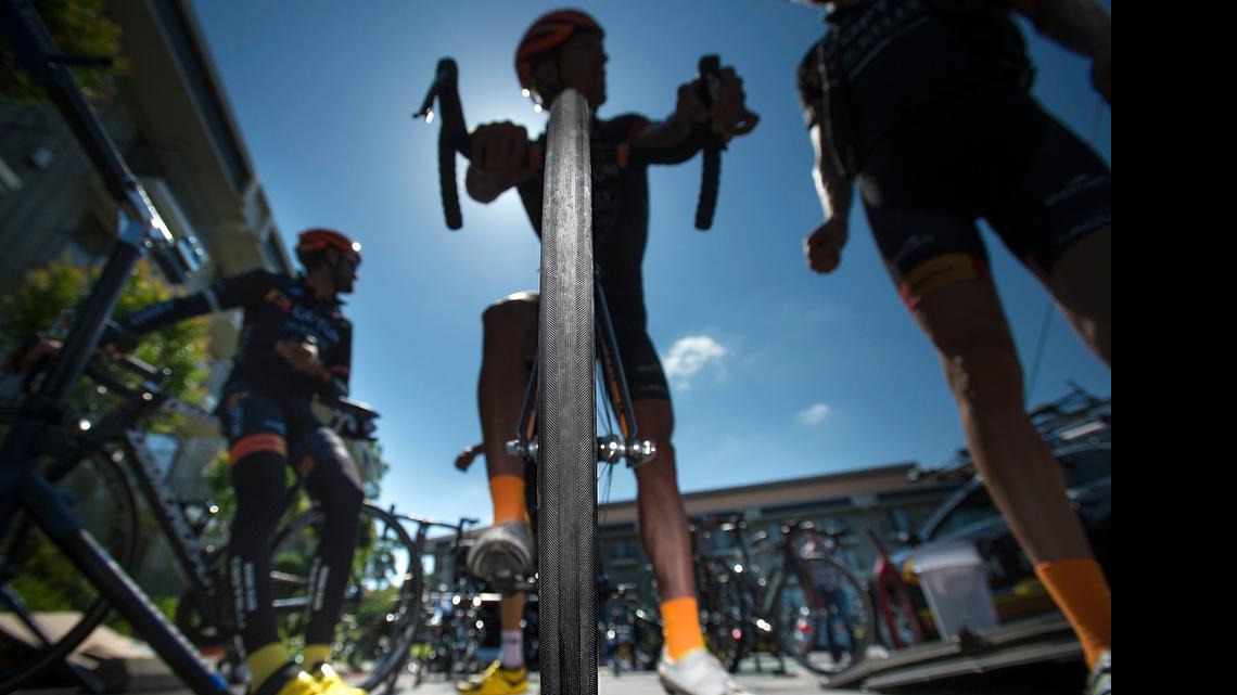 
Optum Pro Cycling rider Tom Zirbel prepares for this weekend’s Amgen Tour of California cycling event at the Doubletree Inn in Sacramento on Friday. Many pro cyclists are now using 25 millimeter tires, while 19 millimeter tires were the standard not too long ago.
