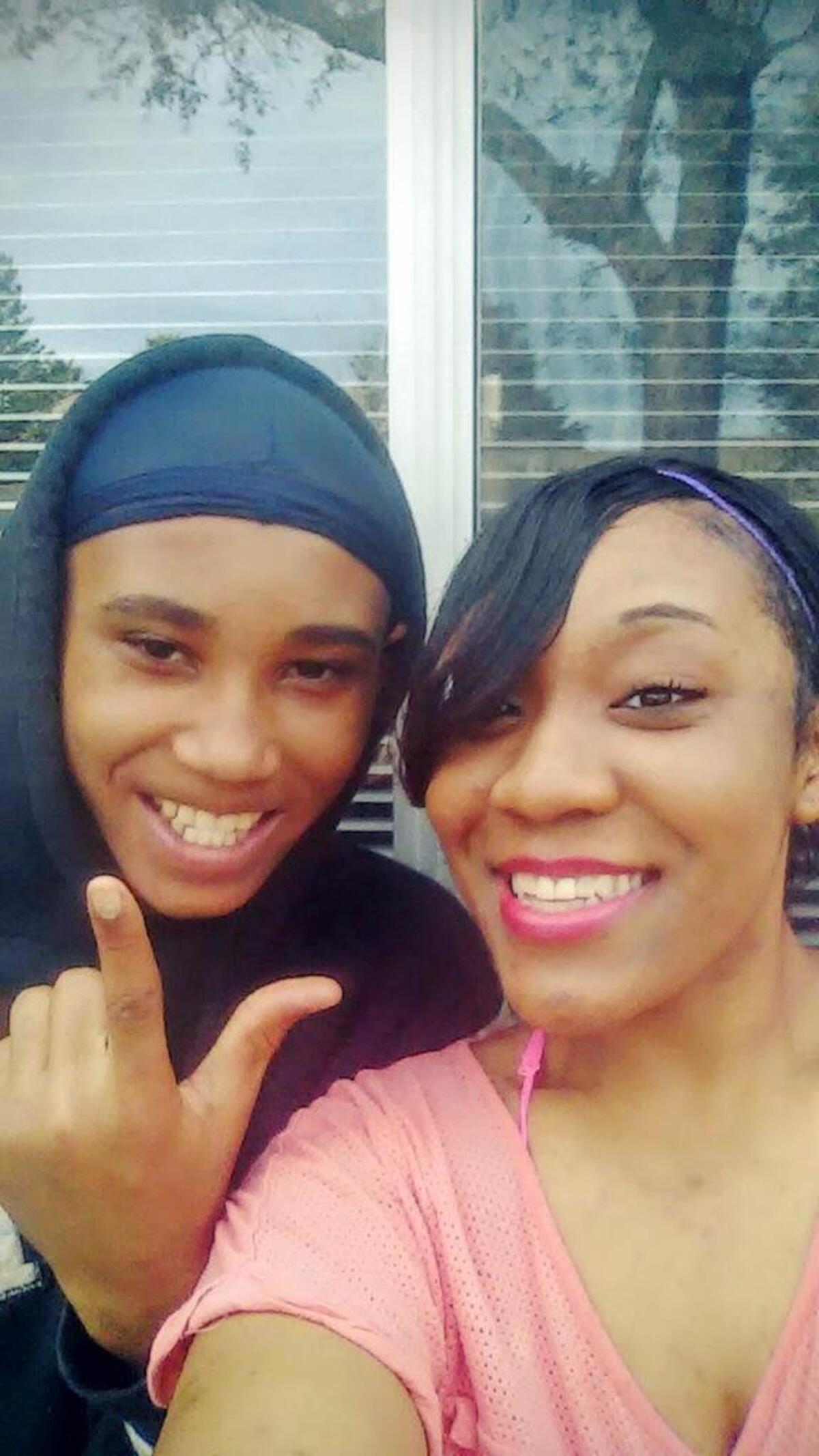 Micheal Powell, the 14-year-old teen who drowned at the American River, smiles for a photograph next to his aunt, Joy Cox.
