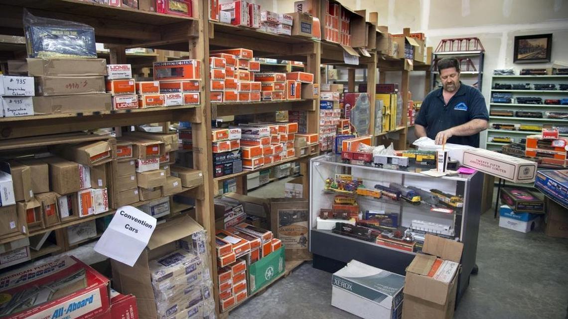 Ed Gibson, son of the late train hobbyist and toy store owner Thomas E. Gibson, organizes trains in a warehouse where his father stored his collectibles Tuesday. The family of Thomas Gibson, who died last April, has discovered a trove of collectibles he left behind and is selling the rare trains in an estate sale.