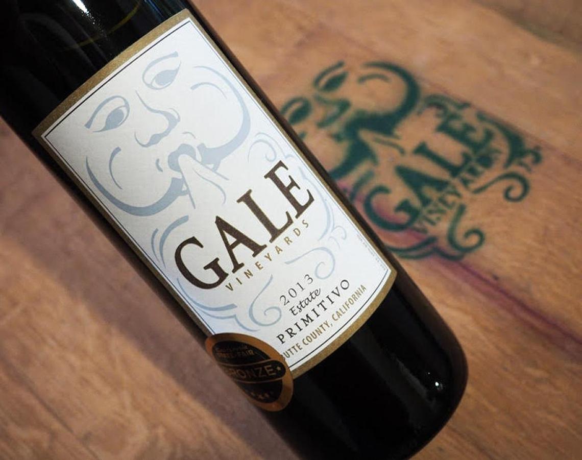 A bottle of the Gale Vineyards 2013 Estate Primitivo against the top of one of the barrels in the winery’s tasting room at Durham, Butte County.