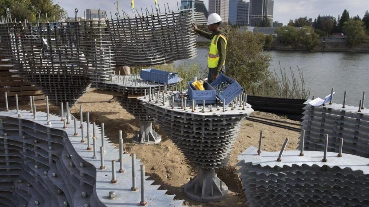 Workers install a 20-ton steel art piece titled “Subtile” south of the Tower Bridge along the River Walk in West Sacramento on Monday, October 30, 2017 in West Sacramento, Calif.