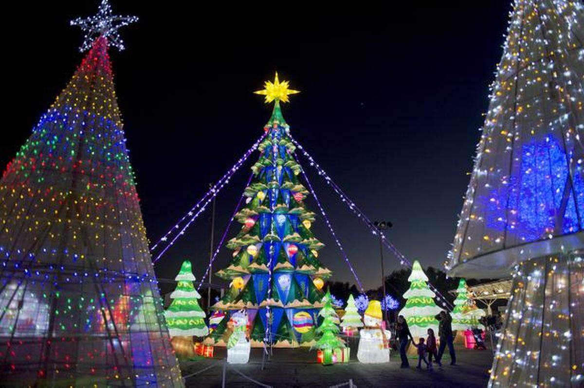 Families enter the Global Winter Wonderland, the spectacular lantern festival and multicultural theme park on Mon., Nov. 24, 2014, at Cal Expo in Sacramento.