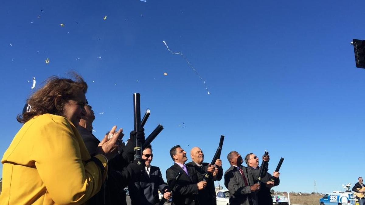 Sacramento officials shoot confetti cannons to celebrate opening of 3.5-mile Cosumnes River Boulevard extension on Tuesday.