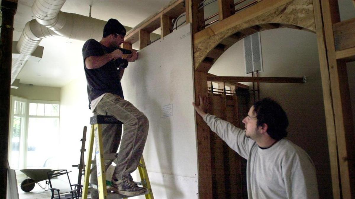 Chris Pendarvis and Jason Griest were once partners in Naked Lounge Tea & Coffeehouse at 1500 Q Street in midtown. Here they are working on the interior on December 18, 2001.