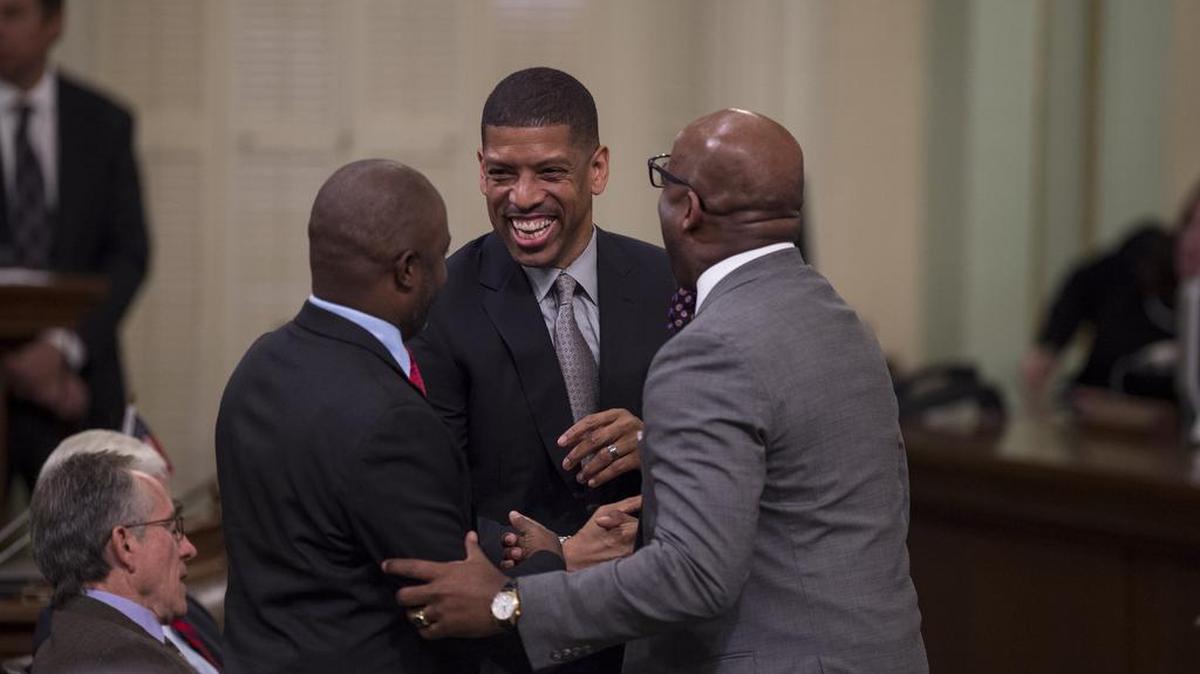 Sacramento Mayor Kevin Johnson meets with Assemblymen Tony Thurmond, D-Richmond, and Mike Gipson, D-Carson, before the Legislature’s session with the Dalai Lama on Monday, June 20, 2016.