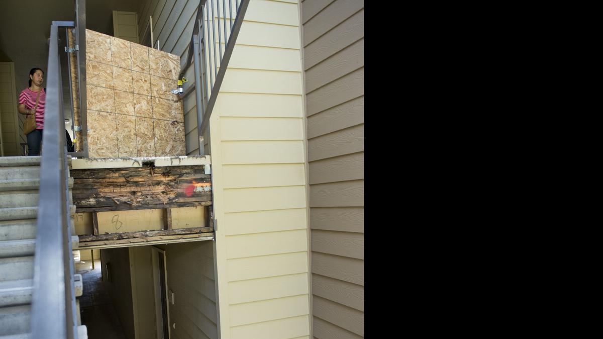 
A bouquet of flowers is left at the scene where Shun Xiang Yuan, 26, of San Francisco, was killed when a concrete and metal staircase fell as he and a friend were coming down from the third floor at the Legends at Willow Creek apartment complex in Folsom. Work is being down to brace up other stairwells in the complex.
