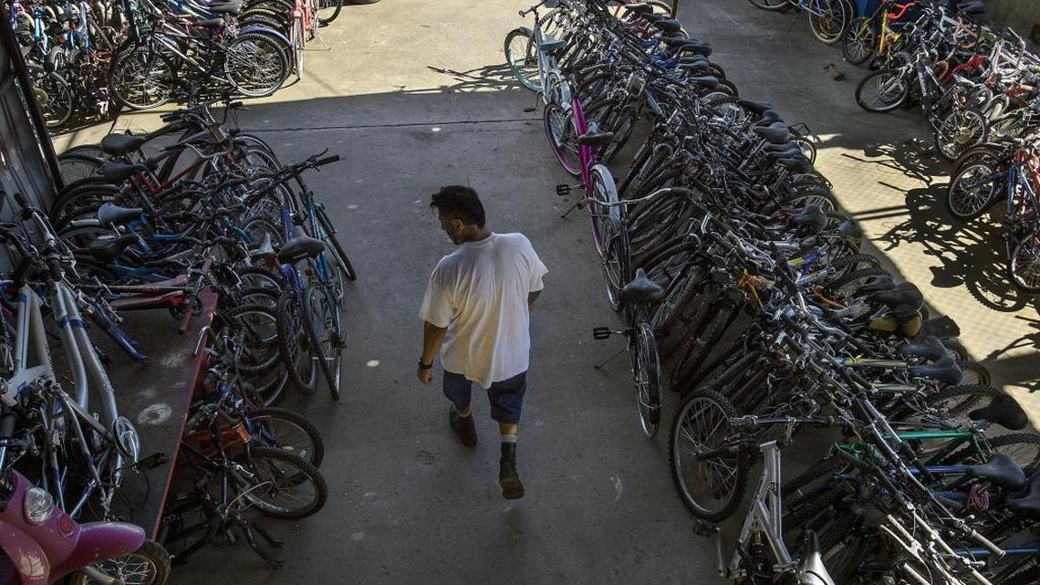 Folsom prison inmate Mauricio Argueta repairs bicycles in a shop at Folsom State Prison in Repressa on Friday. The old donated bikes are repaired and then donated to needy children.